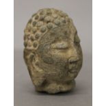 An antique Chinese stone Buddha head. 8.5 cm high.