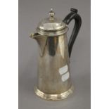 A Mappin and Webb silver coffee pot. 19.5 cm high. 13 troy ounces total weight.