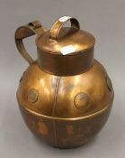 A Guernsey copper cream jug. 26 cm high.