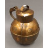 A Guernsey copper cream jug. 26 cm high.