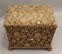 A Victorian upholstered ottoman. 57.5 cm wide.
