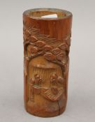 A small Chinese carved bamboo brush pot. 12 cm high.