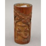 A small Chinese carved bamboo brush pot. 12 cm high.