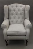 A modern upholstered armchair. 84 cm wide.