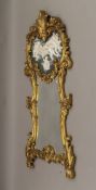 A large modern gilt framed mirror decorated with cherubs. 155 cm high.