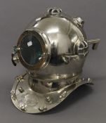 A chrome model divers helmet. 37 cm high.