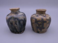 Two small early Chinese pottery ink pots. The largest 5 cm high.