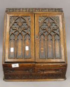 A Victorian oak stationary box. 37 cm high.