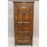 A modern 18th century style oak single door wardrobe. 81 cm wide.