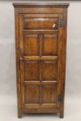 A modern 18th century style oak single door wardrobe. 81 cm wide.