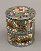 A Chinese enamel decorated two section lidded box. 7 cm high.