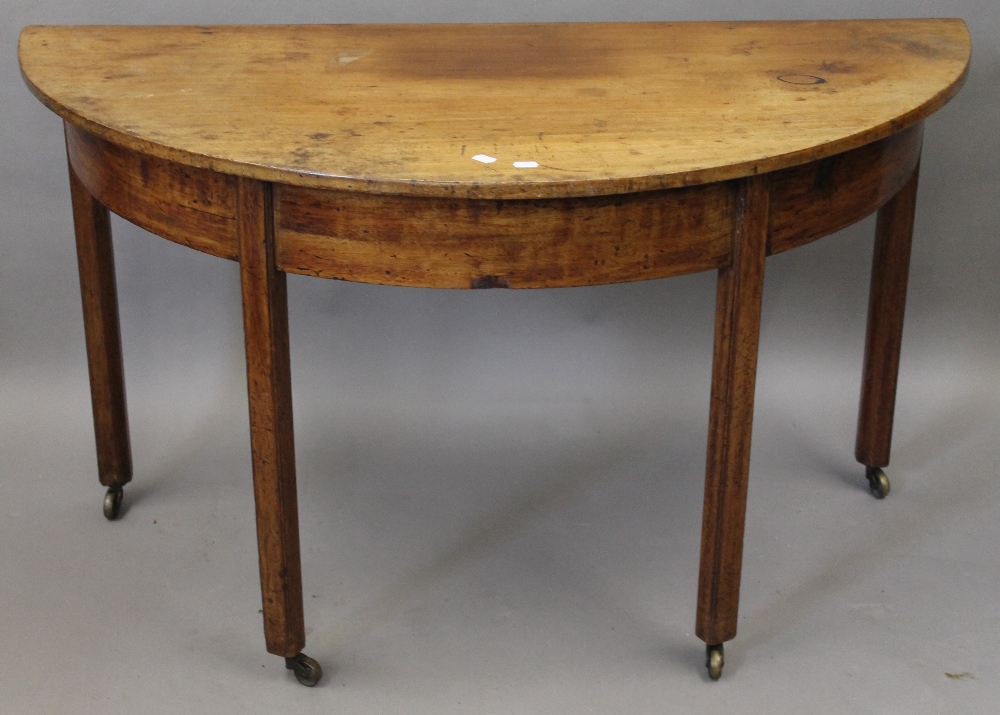 A 19th century mahogany demi lune table. Approximately 120 cm wide.