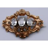 A Victorian unmarked gold paste set brooch. 5 cm wide. 7.2 grammes total weight.
