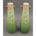 A pair of pottery vases decorated with cranes. 31 cm high.