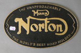 A cast iron 'Norton' sign. 32.5 cm wide.