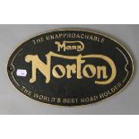 A cast iron 'Norton' sign. 32.5 cm wide.