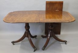 A modern mahogany pedestal dining table. 197 cm long.