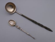 A Georgian silver toddy ladle and a small silver anointing spoon. The former 18 cm long.