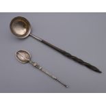 A Georgian silver toddy ladle and a small silver anointing spoon. The former 18 cm long.