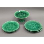 A quantity of Victorian Green Cabbage Leaf plates and a tazza. The latter 11 cm high.