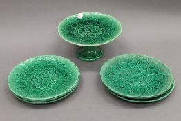 A quantity of Victorian Green Cabbage Leaf plates and a tazza. The latter 11 cm high.