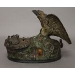A cast iron bird form money box. 20 cm long.