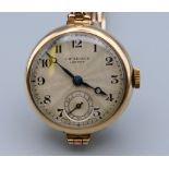 A ladies 9 ct gold cased J W Benson of London wristwatch, with a 9 ct gold J W Benson strap,