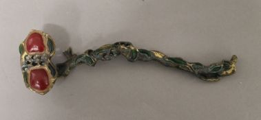 A Chinese ruyi sceptre. 27 cm long.