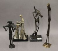 Three various bronze sculptures and a painted terracotta sculpture. The largest 39 cm high.