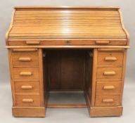 An early 20th century oak roll top desk. 121 cm wide.