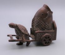 A Japanese carved wooden turtle and fish. 8 cm long.