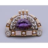 A 14 K gold, amethyst and enamel brooch. 3 cm wide.