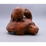A group of carved wooden turtles. 7 cm high.