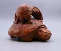 A group of carved wooden turtles. 7 cm high.