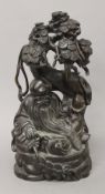 A Chinese carved hardwood figure. 45 cm high.