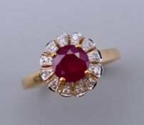 A 9 ct gold, ruby and diamond ring. Ring size L/M. 3.1 grammes total weight.
