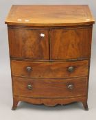 A George III mahogany commode. 60.5 cm wide.