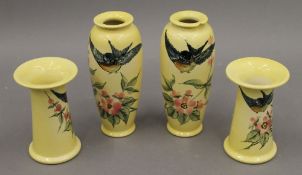 Four Christopher Dresser Ault vases. The largest 16 cm high.