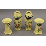 Four Christopher Dresser Ault vases. The largest 16 cm high.