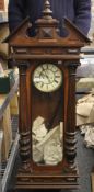 A 19th century walnut cased Vienna wall clock. 120 cm high.