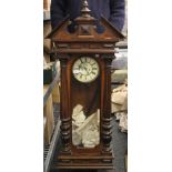 A 19th century walnut cased Vienna wall clock. 120 cm high.