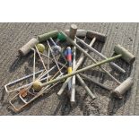 A quantity of vintage croquet equipment.