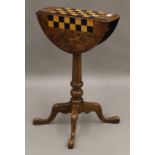 A Victorian inlaid walnut folding games table. 47 cm wide.