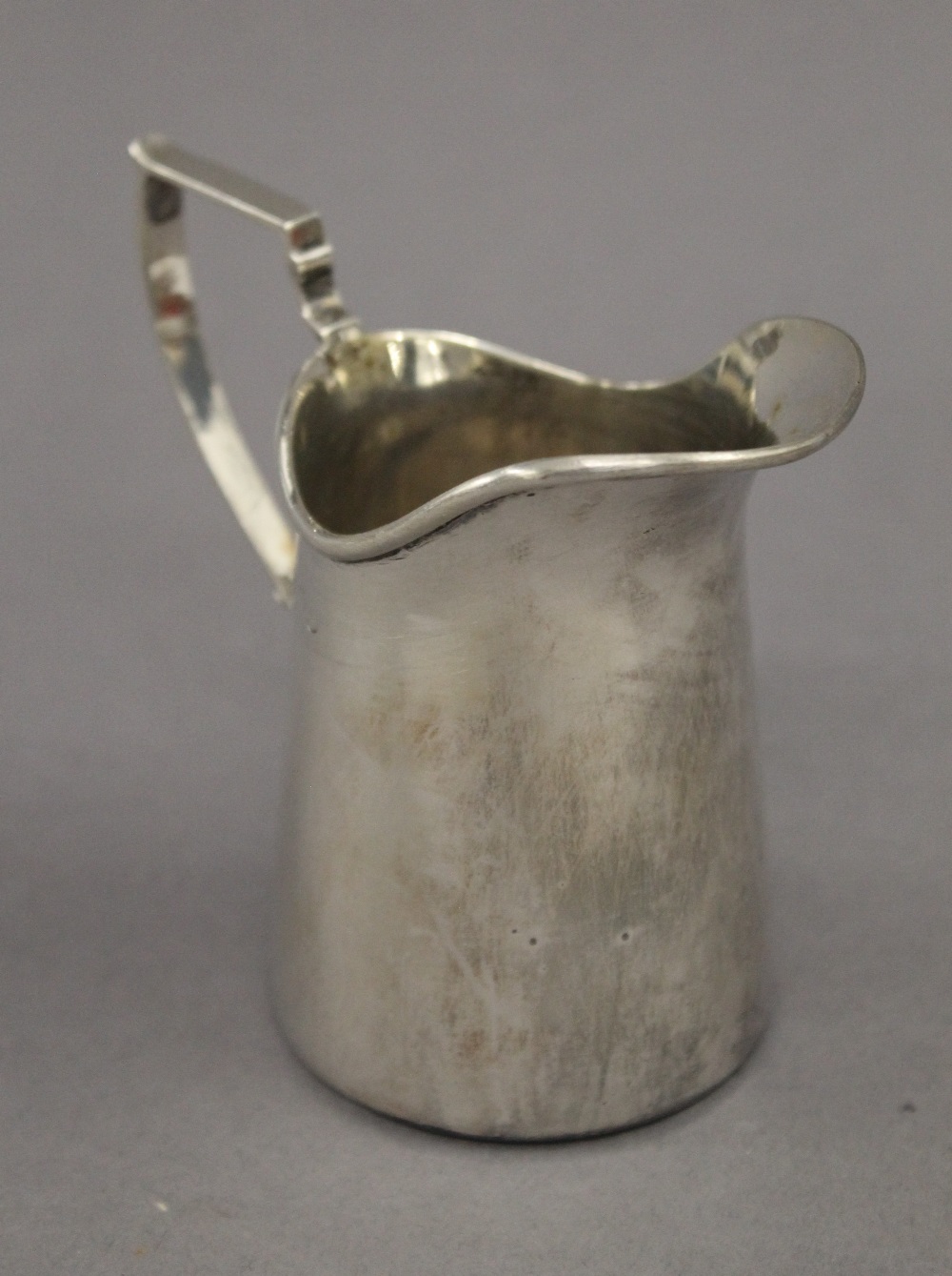 A silver cream jug. 9 cm high. 2.9 troy ounces.