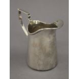 A silver cream jug. 9 cm high. 2.9 troy ounces.