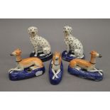 Three Staffordshire greyhounds and two Staffordshire dalmatians. The latter each 12.5 cm high.