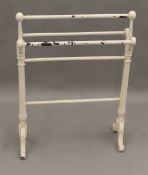 A Victorian white painted towel rail. 69 cm long.