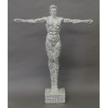 A silver coloured model of a gymnast. 58 cm high.