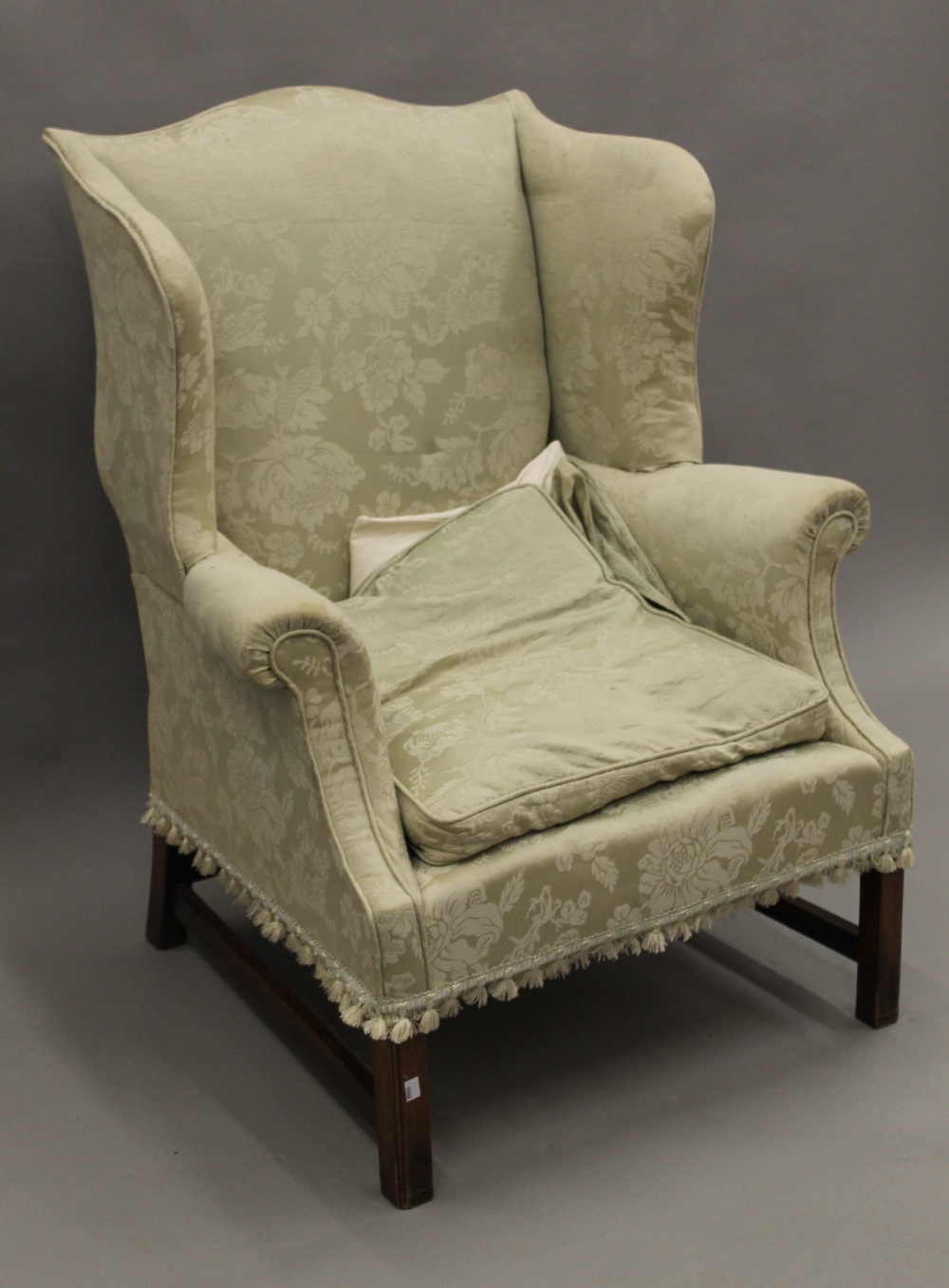 An early 20th century upholstered wing back armchair. 80 cm wide. - Image 2 of 8