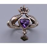 A silver Claddagh ring. Ring size M.